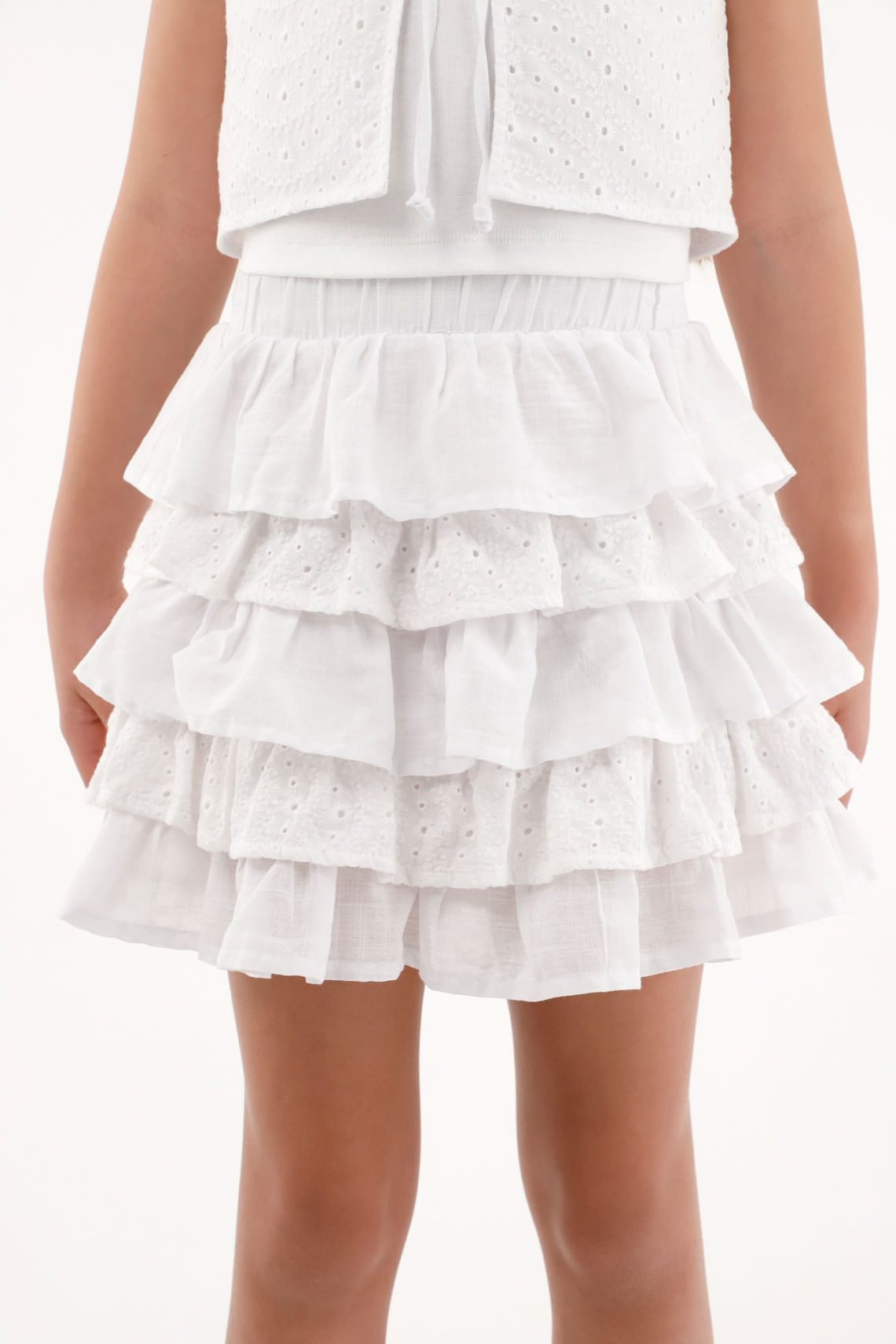 Falda color crudo con boleros para niña