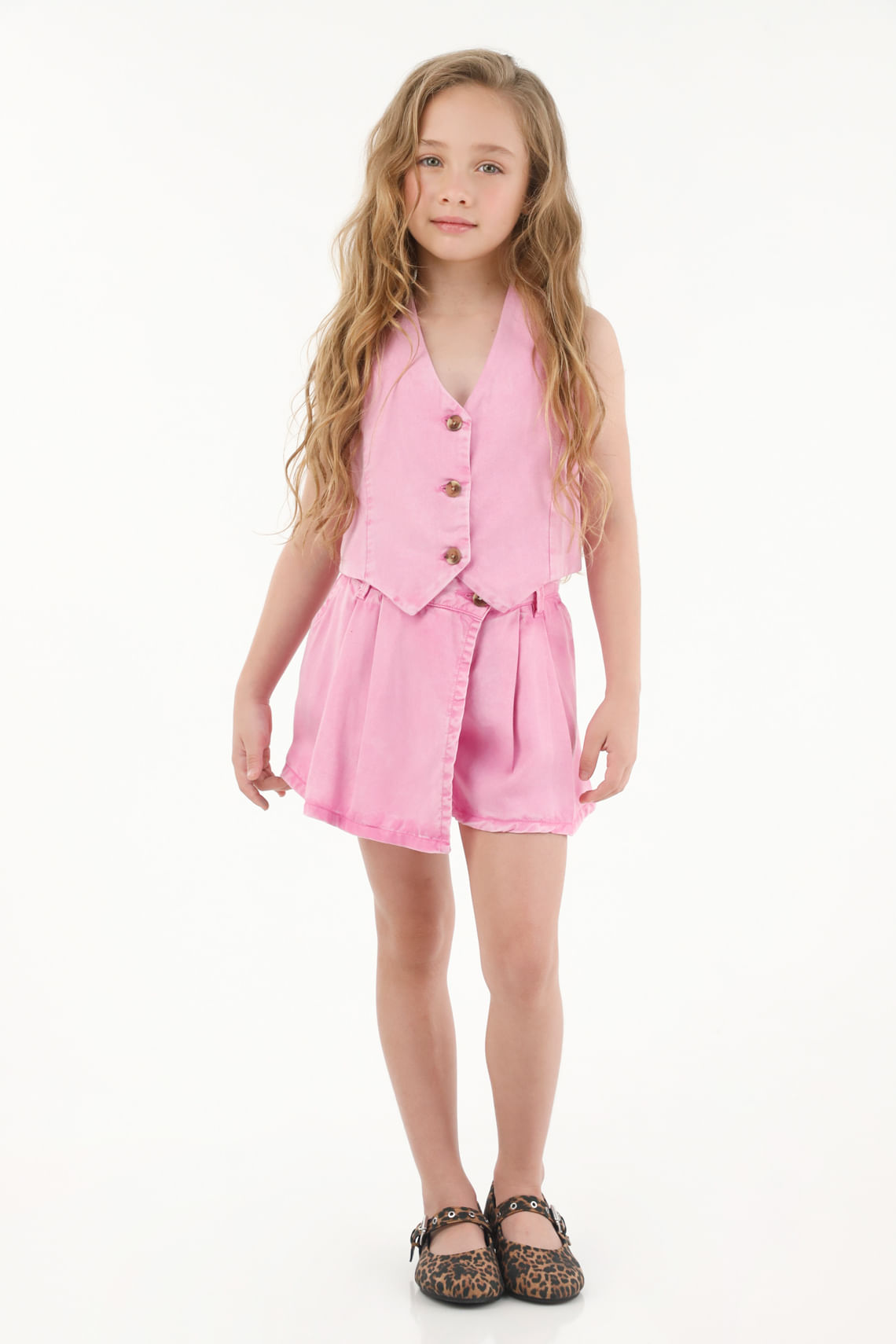 Falda short rosada con tablas para niña