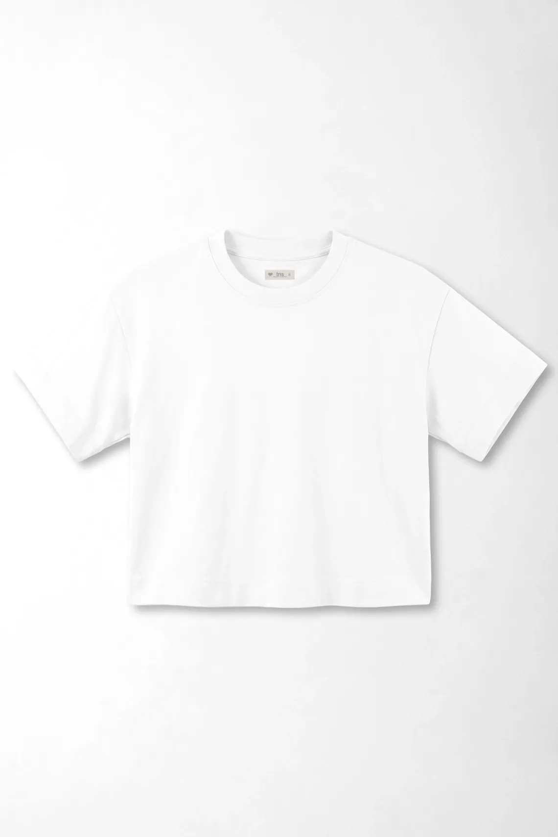 Camiseta boxy con largo cropped en algodón blanco para mujer